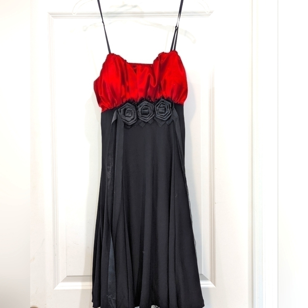 Snap red bustier and black strappy formal dress